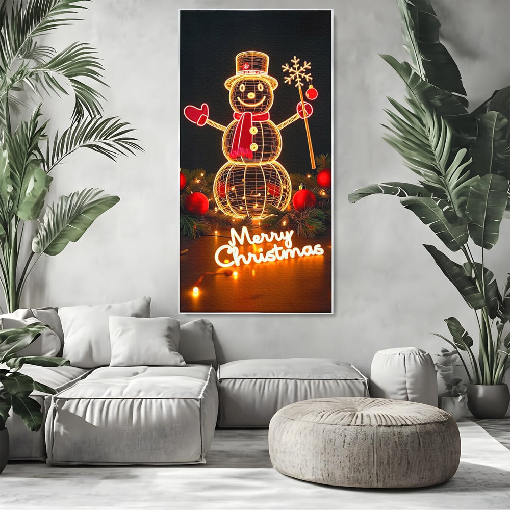 Tablou canvas cu ilustratie cu om de zapada luminos, in rama de aluminiu argintiu, pe perete intr-un living
